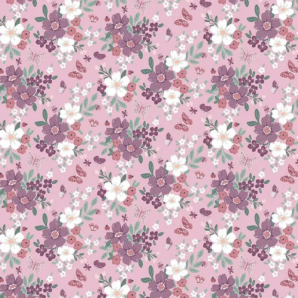 A repeating floral pattern on a dusty pink background with purple and white flowers, green leaves, and small butterflies. A ruler along the bottom edge shows the scale of the print.