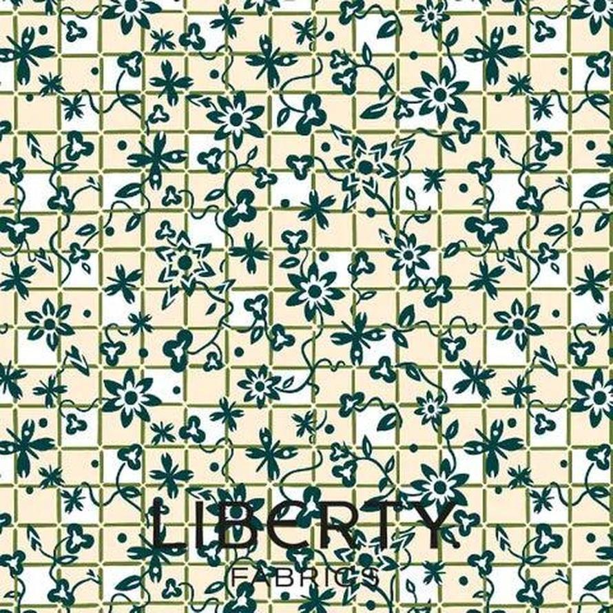 Liberty Arthurs Garden 2 fabric: cream with dark green floral vine pattern on a checkered background.