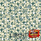 Liberty Arthurs Garden 2 fabric: cream with dark green floral vine pattern on a checkered background.