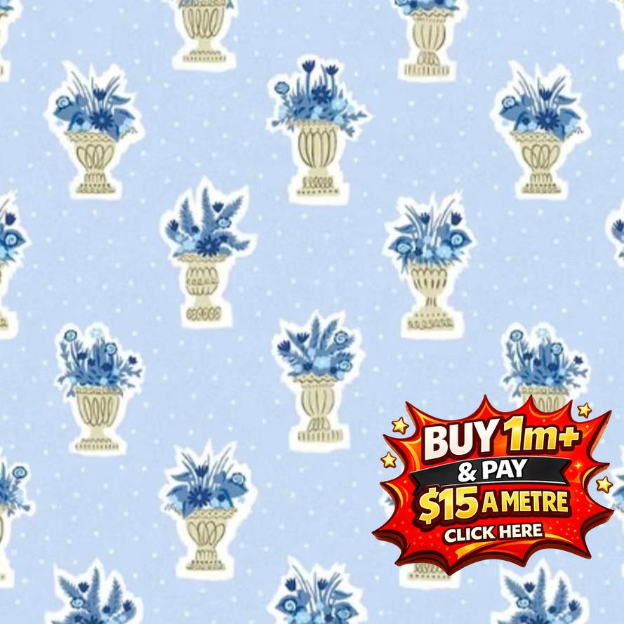 Light blue fabric with white polka dots and repeating pattern of blue floral arrangements in gold urns.