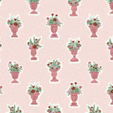 Pink fabric with a repeating pattern of ornate pink vases holding green and red floral arrangements.