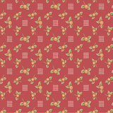 Red fabric with a repeating pattern of small coral flowers, green leaves, and white crosshatch grids.
