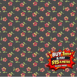 Dark gray fabric with a repeating pattern of small red and yellow flowers with green stems.