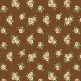 Brown fabric with a repeating pattern of delicate cream and peach roses with green leaves.