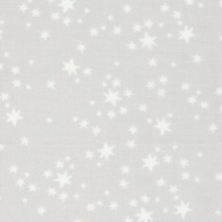A light gray fabric or wallpaper pattern featuring a scattered print of white stars of various sizes.