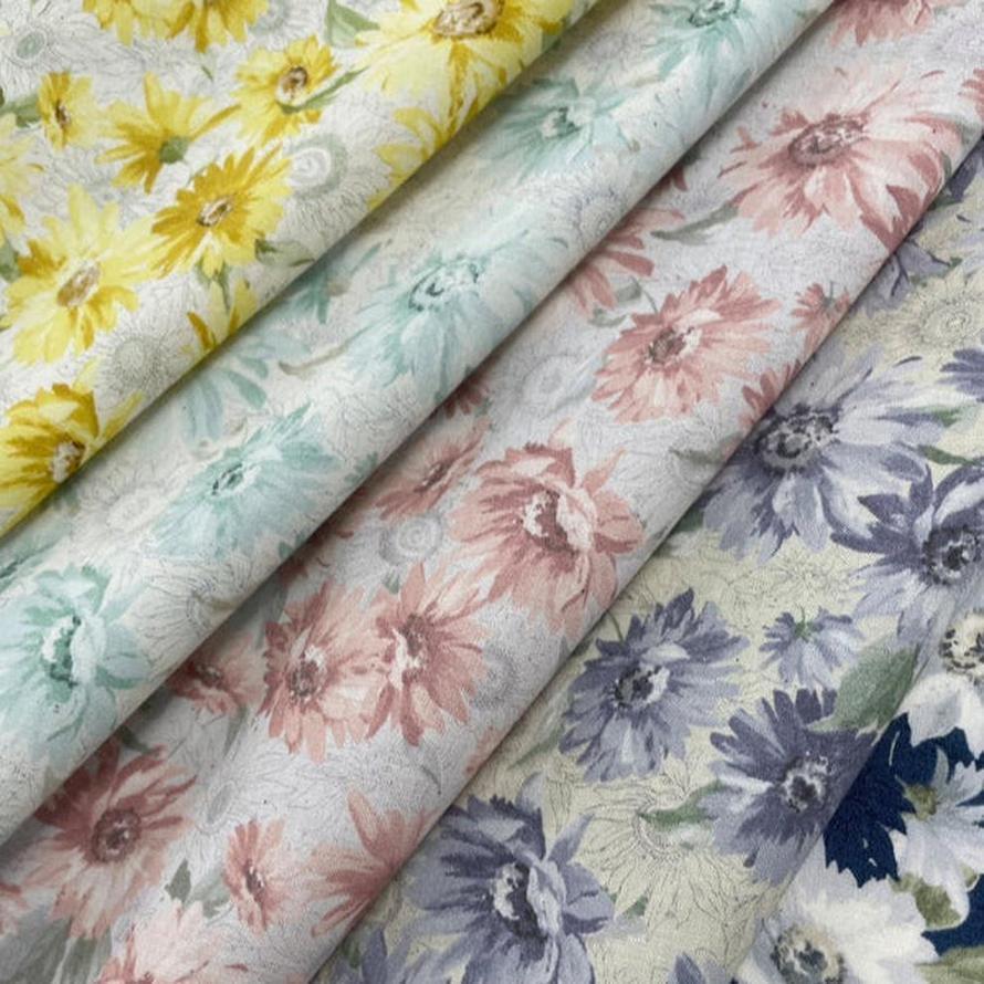 Seeded cotton shirting fabric in four floral prints: yellow, mint, pink, and lavender.