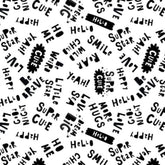 White fabric with black words like "Wild Child," "Cute," "Smile," and "Love.