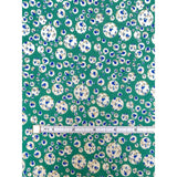 Green Liberty Tana Lawn fabric with white circles and blue floral Joanna Rose print.