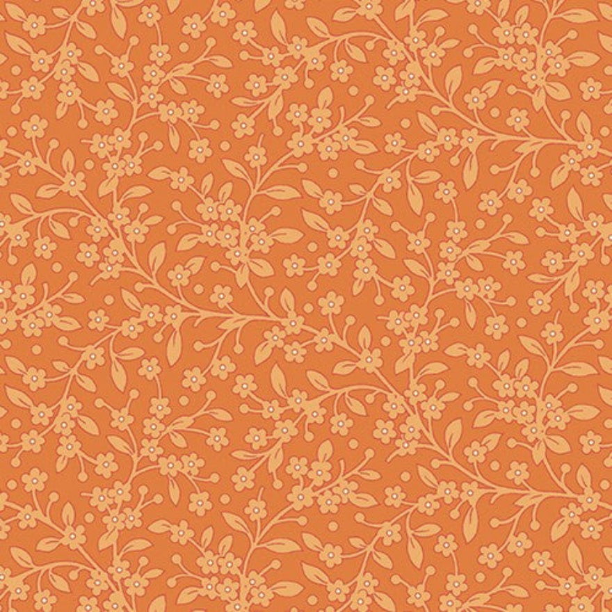 A repeating floral pattern featuring delicate light peach branches, small blossoms, and tiny dots on a warm orange background.