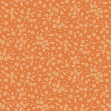 A repeating floral pattern featuring delicate light peach branches, small blossoms, and tiny dots on a warm orange background.