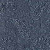 A close-up of a fabric or wallpaper pattern featuring a detailed paisley design in shades of slate blue and navy.