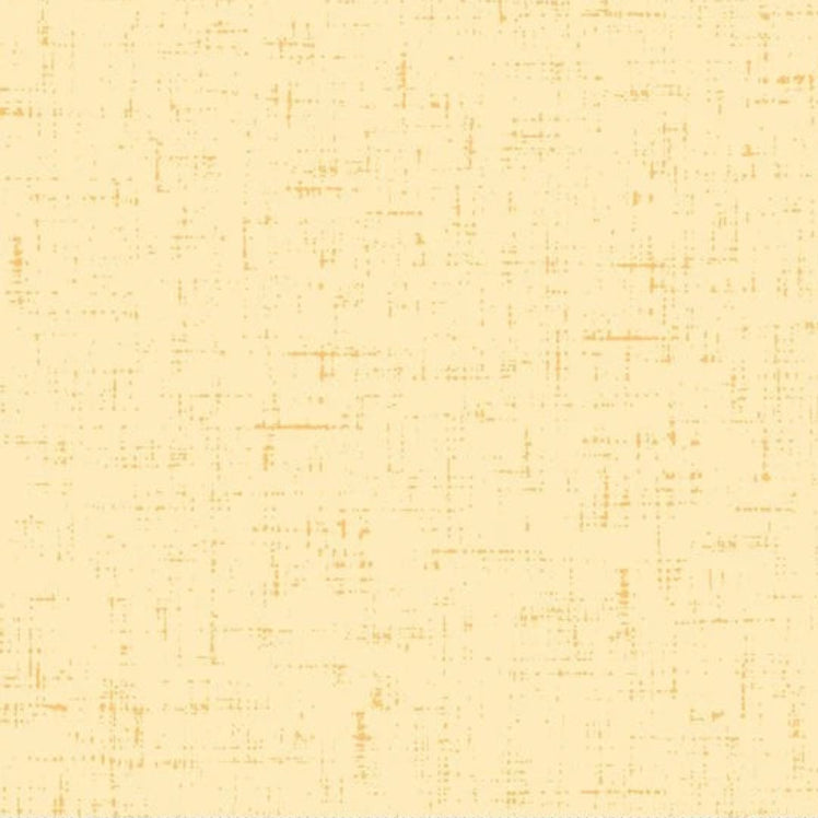 A close-up of a fabric or material swatch in a warm cream/beige tone with a subtle orange-brown textured crosshatch pattern, with a ruler along the bottom edge showing measurement markings.