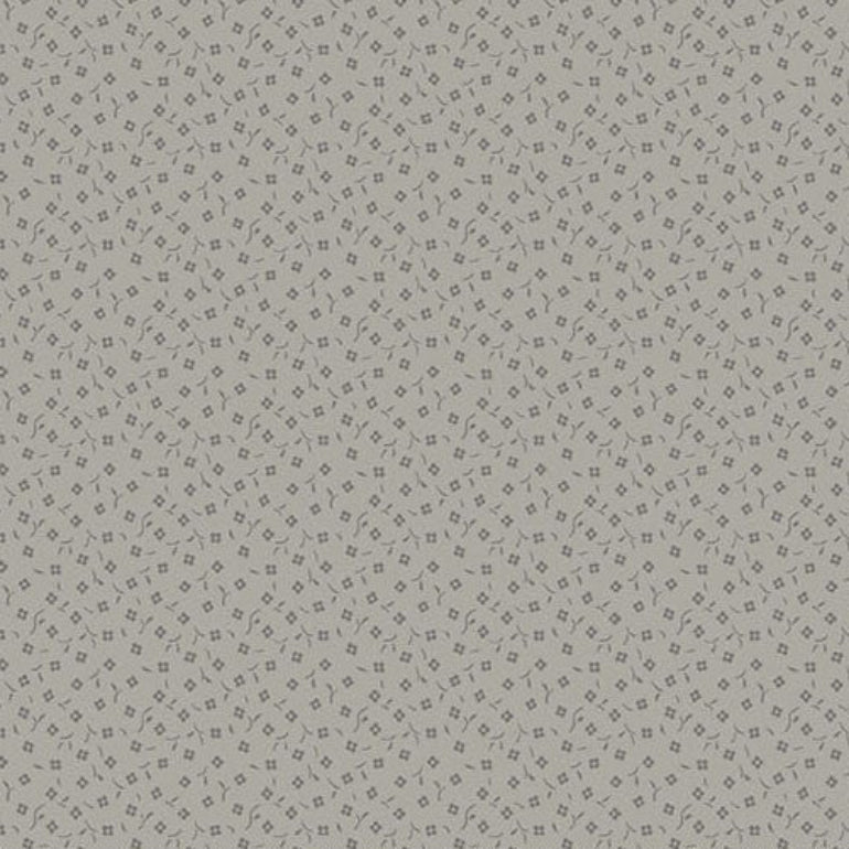 A close-up fabric pattern swatch showing a light blue background with an irregular dark blue crackle or web-like line pattern. A ruler and Andover fabric branding are visible along the bottom edge.