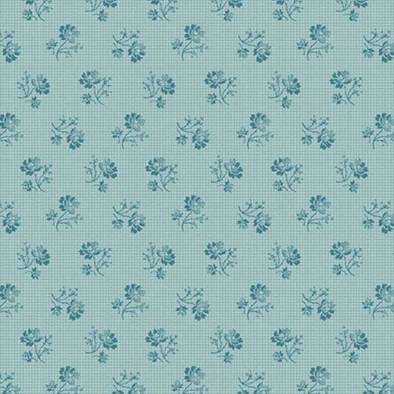 A close-up fabric pattern swatch showing a light blue background with an irregular dark blue crackle or web-like line pattern. A ruler and Andover fabric branding are visible along the bottom edge.