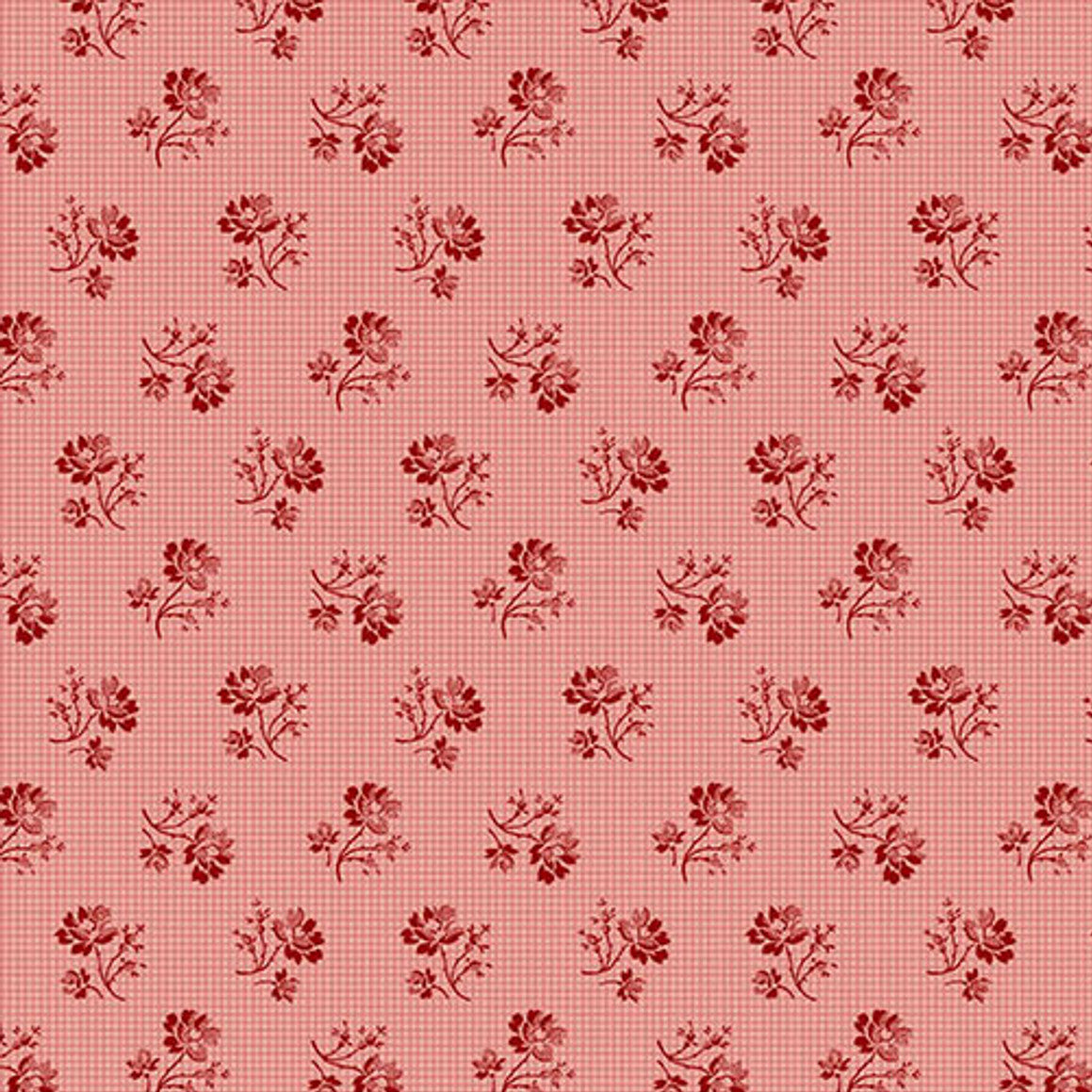Navy blue fabric with small white snowflake pattern and a ruler at the bottom for scale.