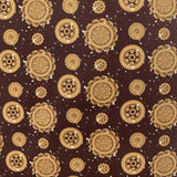 Pattern of gold gears on a brown background