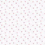 White fabric with a delicate pink and purple floral pattern and a ruler along the bottom edge showing measurements.
