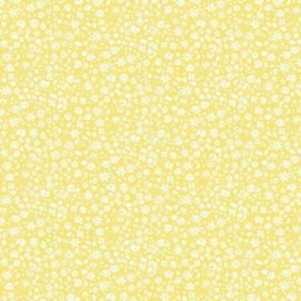 A close-up of a yellow fabric or material with a dense white floral and dot pattern covering the full frame.