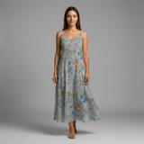 Woman in a gray cotton printed lawn maxi dress with blue and orange floral patterns.