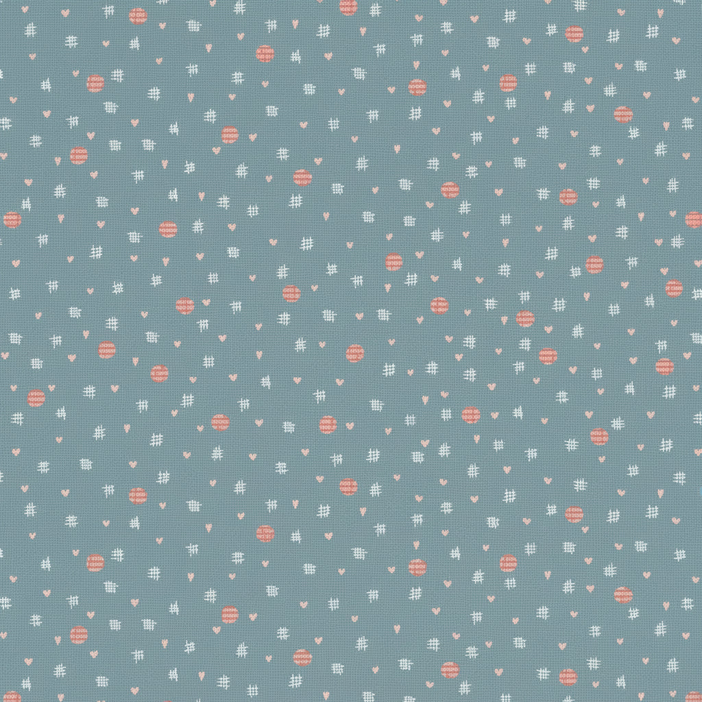 A repeating pattern of small white and coral-pink motifs on a dusty blue background, including tiny hearts, dots, and abstract shapes.