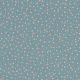 A repeating pattern of small white and coral-pink motifs on a dusty blue background, including tiny hearts, dots, and abstract shapes.
