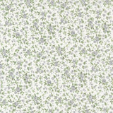 A repeating floral pattern featuring small lavender-gray flowers and green leaves on a warm off-white background.