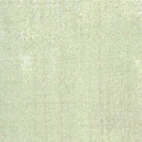 A close-up of a light sage green textured fabric with a subtle woven linen-like pattern.