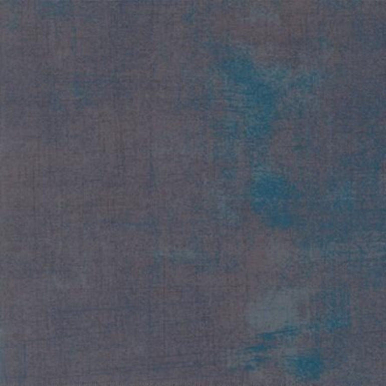 A square fabric texture swatch showing a mottled, distressed pattern in slate blue, gray, and teal.