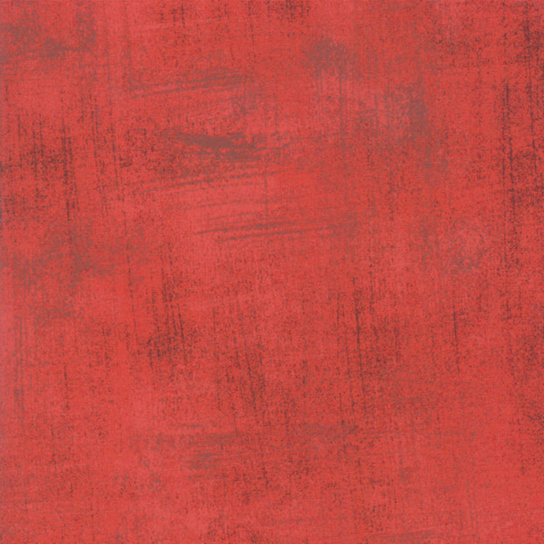 Red fabric texture with a ruler at the bottom for scale