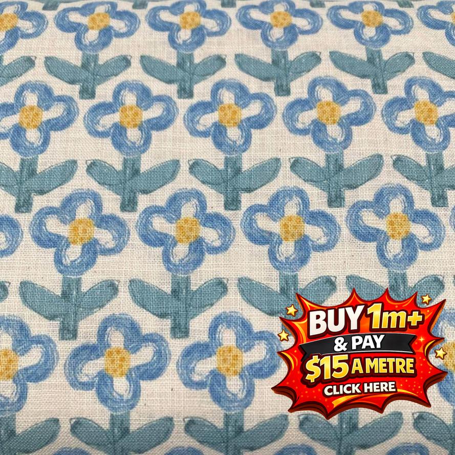 Hanako cotton printed poplin fabric with blue and yellow floral pattern on a light background.