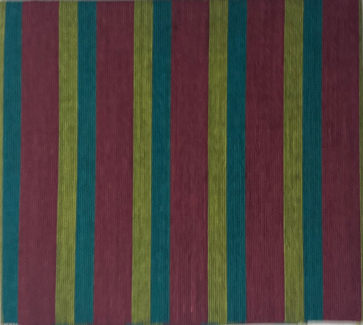 Color swatch with stripes on a white sheet of paper, placed on a wooden surface.