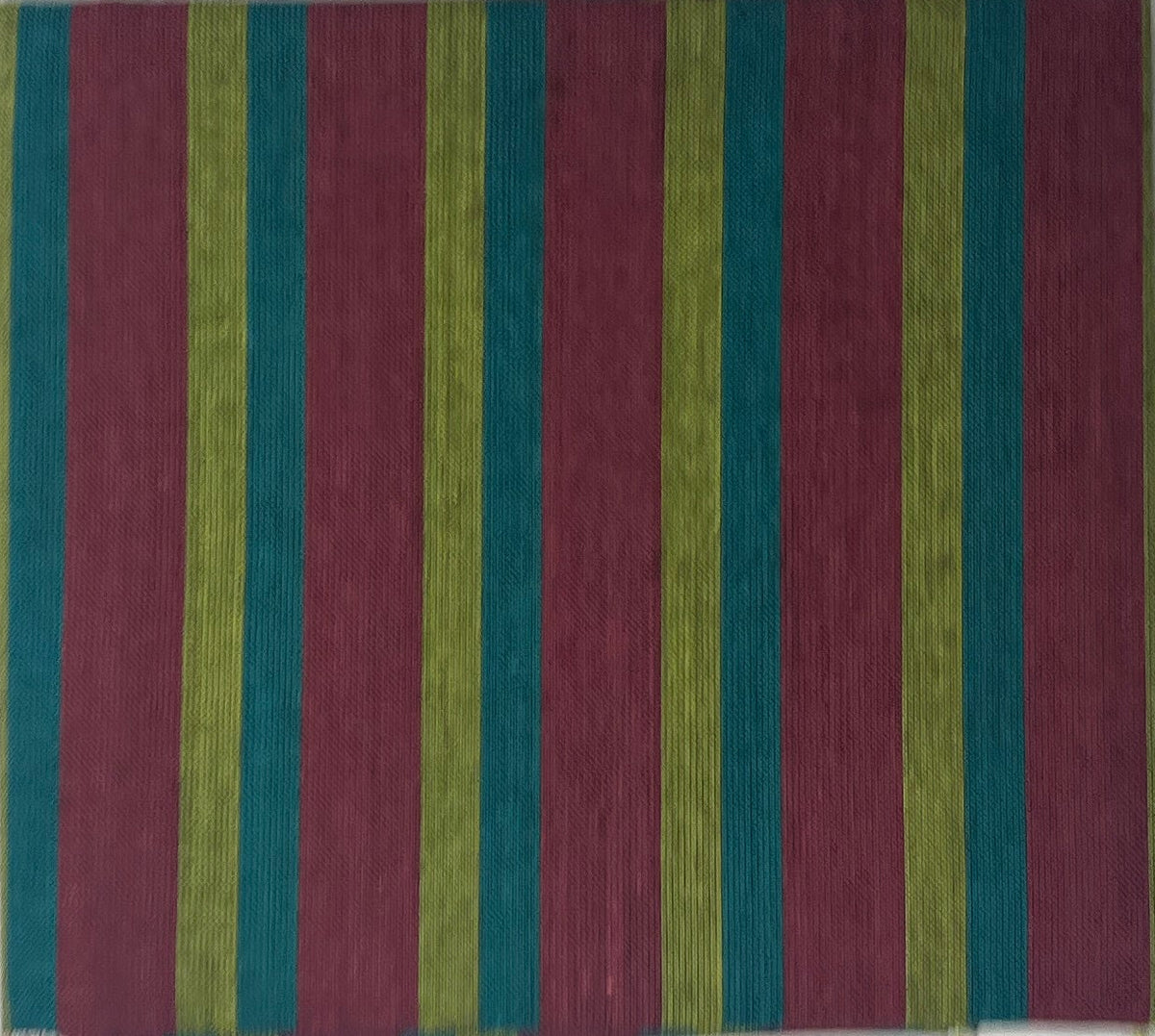Color swatch with stripes on a white sheet of paper, placed on a wooden surface.