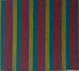Color swatch with stripes on a white sheet of paper, placed on a wooden surface.