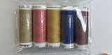 Set of five spools of thread in various colors in a clear plastic package on a white background.