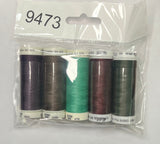Set of sewing threads in a clear package on a wooden surface