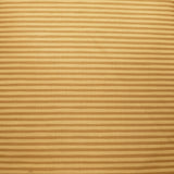 A close-up of a beige and brown horizontally striped fabric draped over a dark wooden surface, with a floral-patterned fabric and other items partially visible in the background.