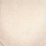 A folded piece of light beige fabric with a subtle woven texture, resting on a dark wooden surface.