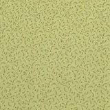 A long rectangular sheet of beige wallpaper or adhesive contact paper with a dense, small-scale dark gray abstract wavy pattern, laid flat on a dark reddish-brown wooden surface.