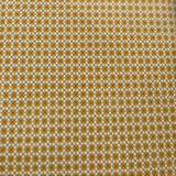 Close-up of a patterned tie with a geometric design on a plain background