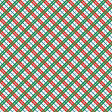 A repeating diagonal plaid pattern in red, green, and blue over a white background, with a small ruler strip along the bottom edge showing measurements.