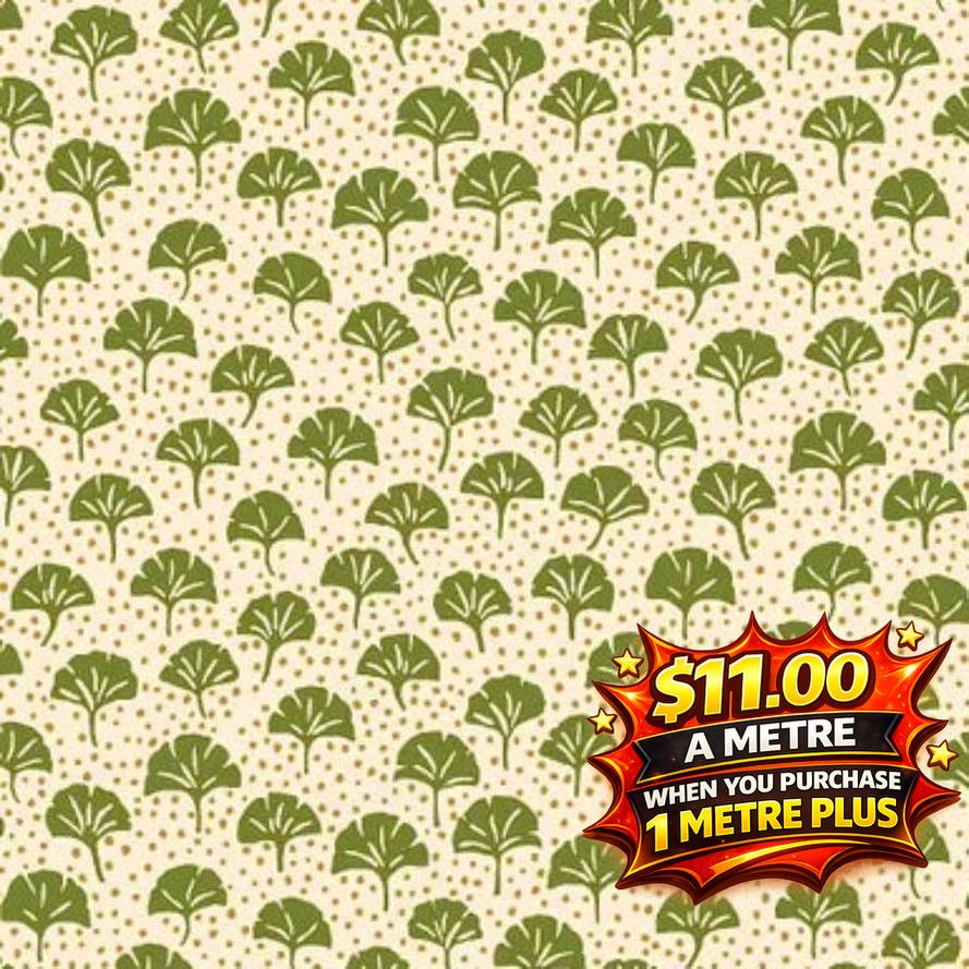 Liberty Arthurs Garden green ginkgo leaf and gold dot patterned fabric on a cream background.