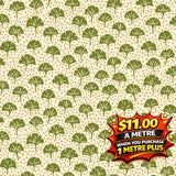Liberty Arthurs Garden green ginkgo leaf and gold dot patterned fabric on a cream background.