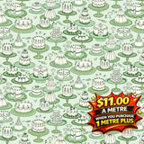 Light green fabric with white cakes on stands, priced at $11.00 a metre.