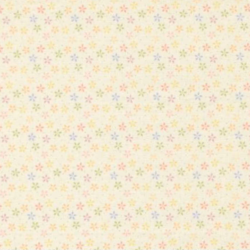 A close-up of a fabric or wallpaper pattern featuring a repeating design of tiny, multi-colored flower motifs on a warm cream background.