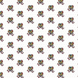 A repeating pattern of small heart-shaped motifs filled with multicolored puzzle-piece style details, each accompanied by a dark red ribbon or bow, on a white background with faint light gray dots.