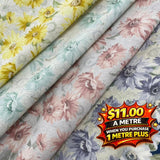Seeded cotton shirting fabric in four floral prints: yellow, mint, pink, and lavender.