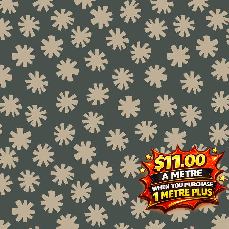 Dark green cotton fabric with scattered light beige starburst patterns, priced at $11.00 a metre.