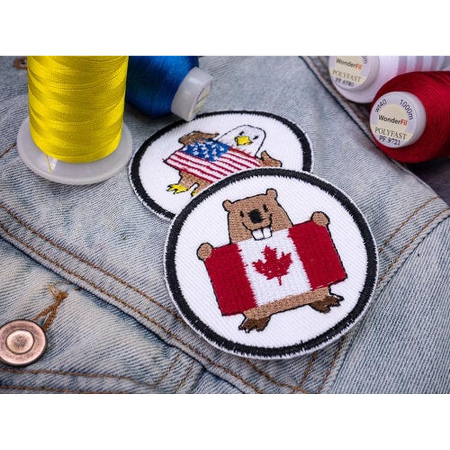 Polyfast 40wt trilobal polyester thread in yellow, blue, and red with embroidered USA and Canada patches.