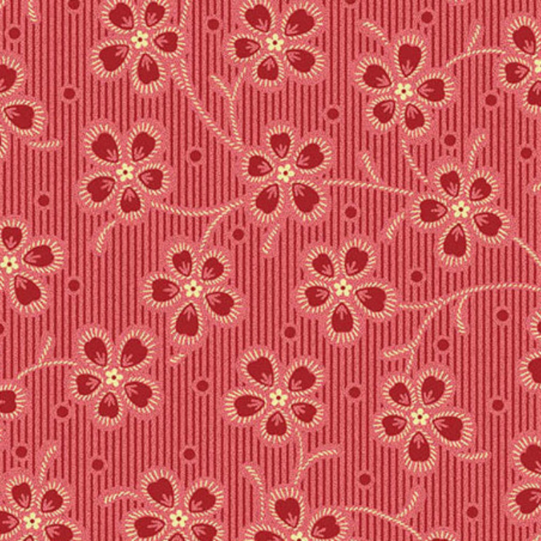 Red and pink striped fabric with a repeating floral vine pattern in cream and dark red, shown with a ruler at the bottom for scale.