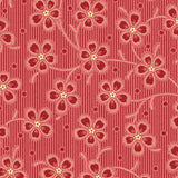 Red and pink striped fabric with a repeating floral vine pattern in cream and dark red, shown with a ruler at the bottom for scale.